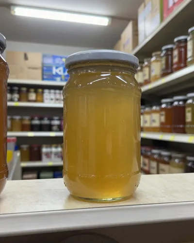 Honey producer, before: honey jar on a shelf