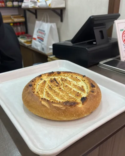 Bakery, before: village bread on a plastic tray