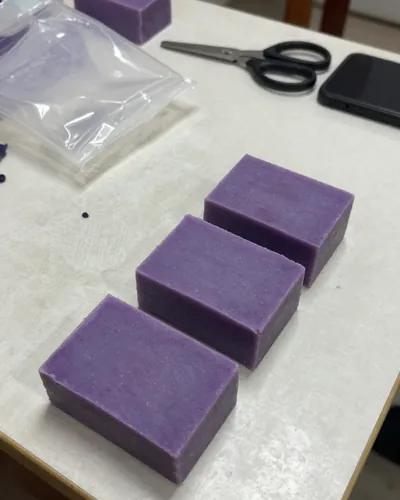 Soap workshop, before: lavender soaps on a messy table